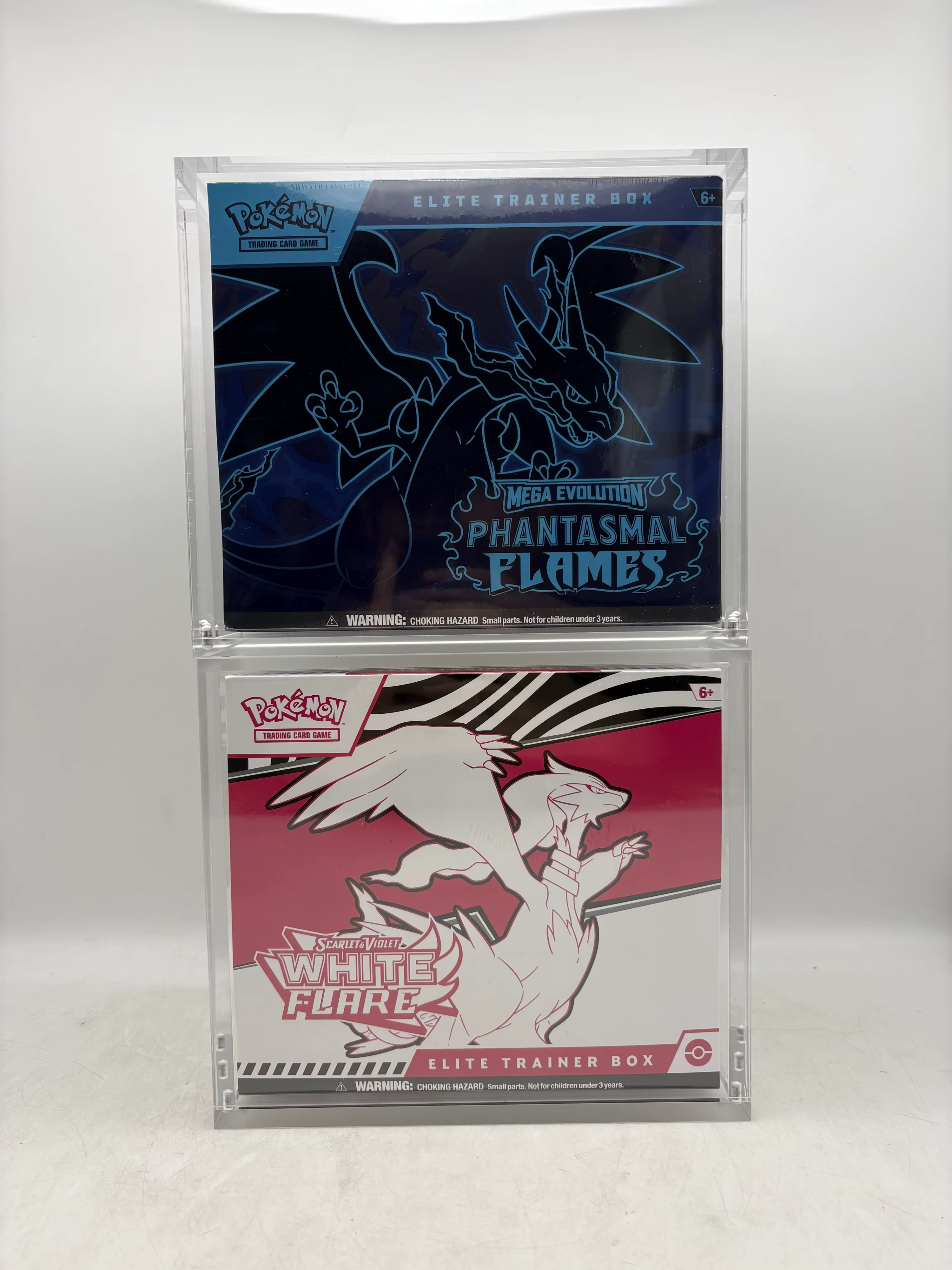 Two cases stacked vertically with sealed boxes inside