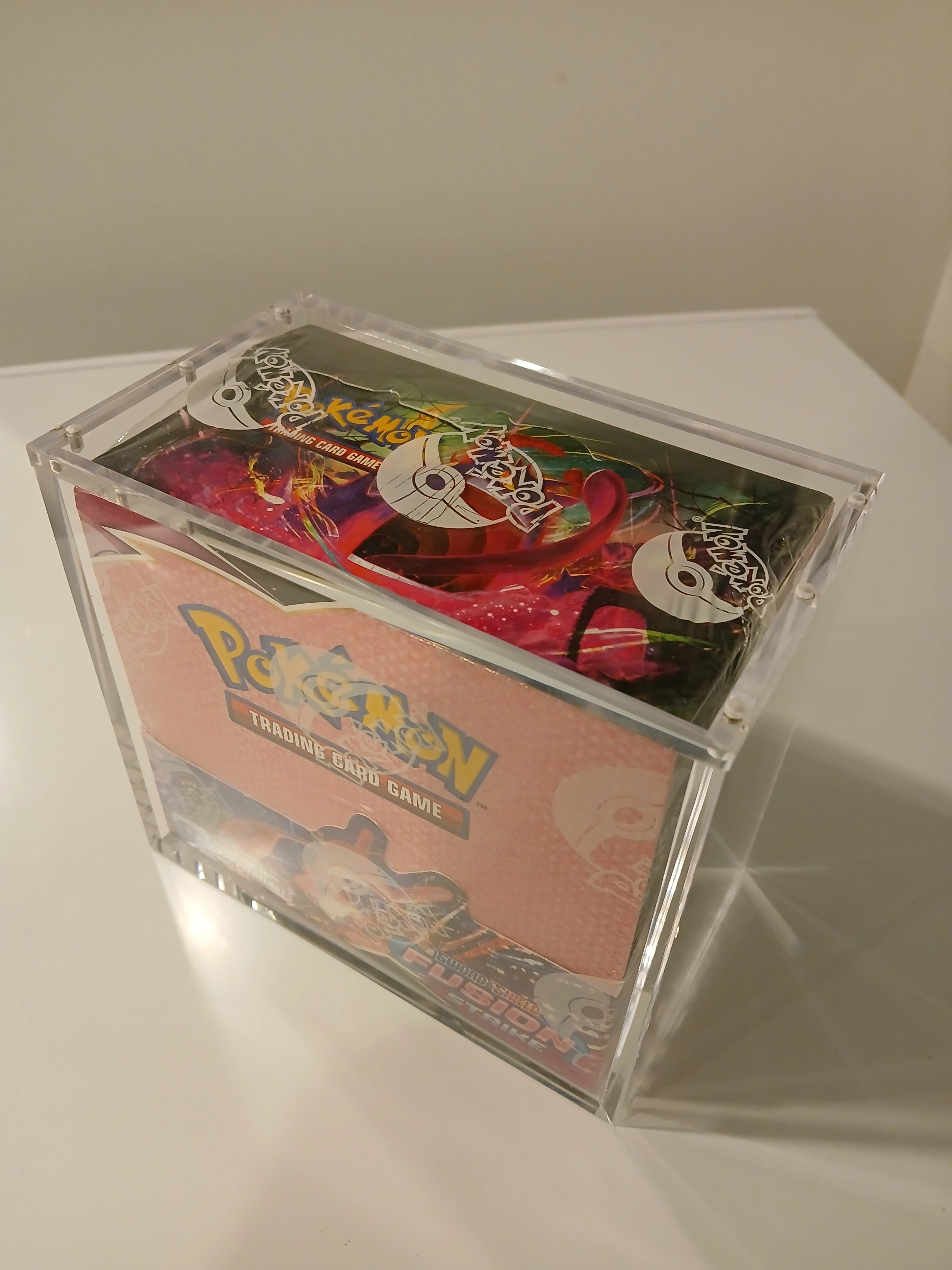 Top-down view of the flush magnetic lid seam on a booster box case
