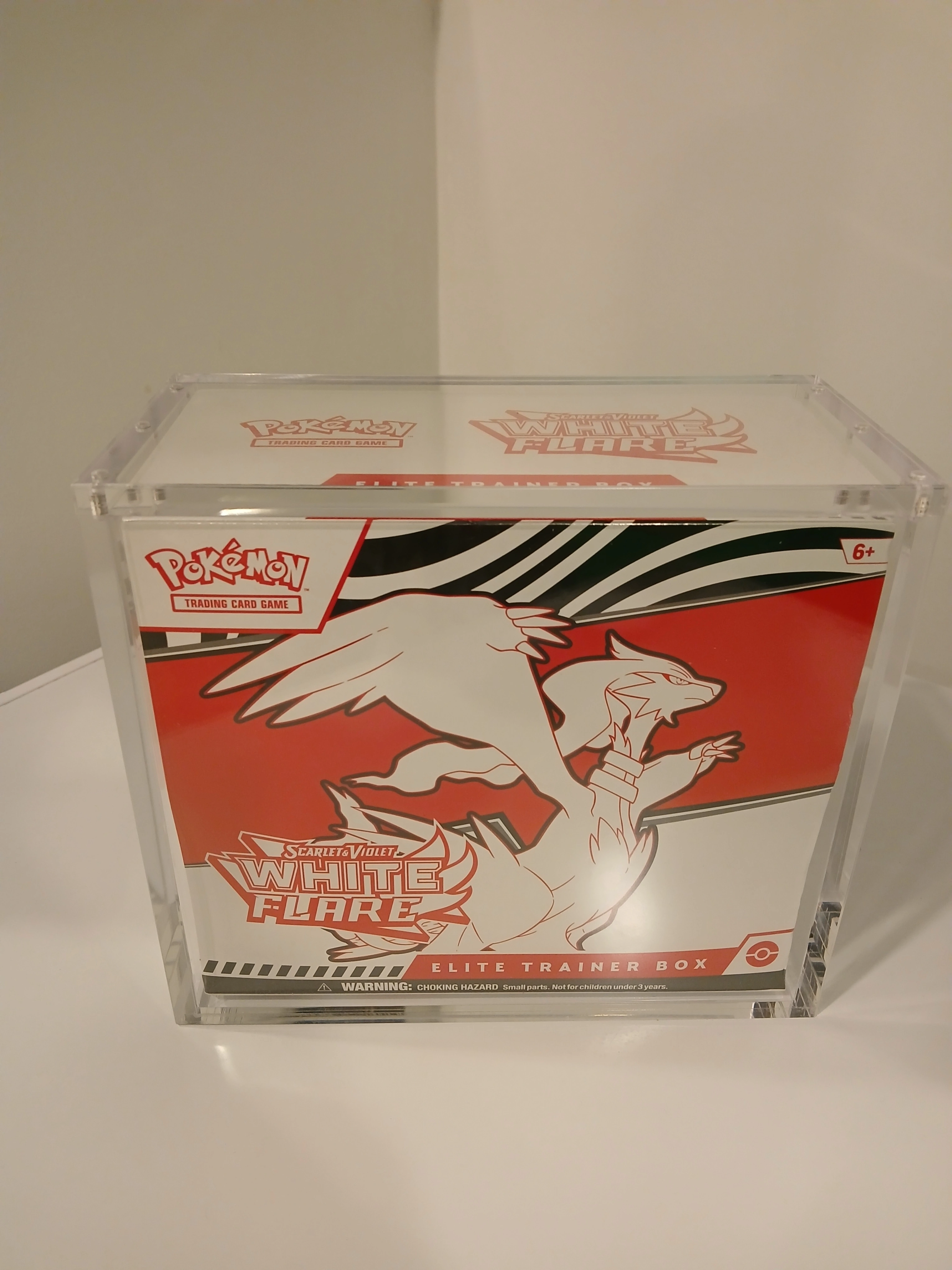 Elite Trainer Box sealed inside the acrylic case, front view